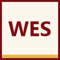WES logo with green circular border and black “WES” lettering